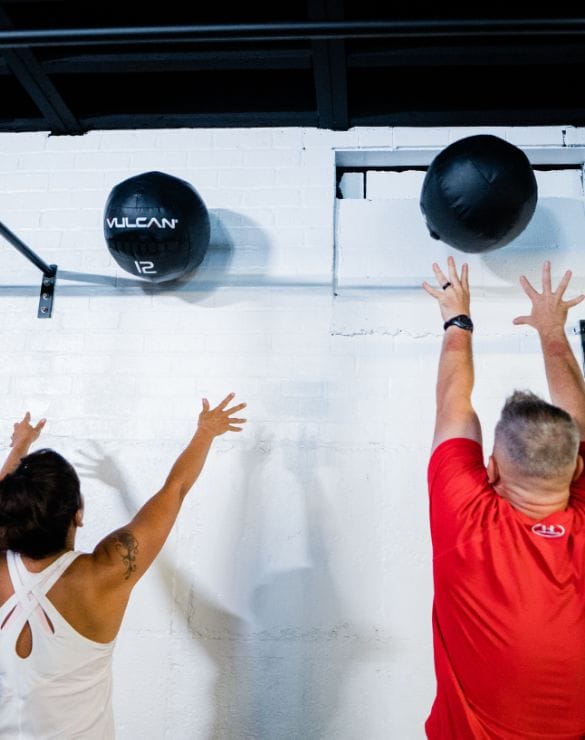 woman and man working out next to eachother